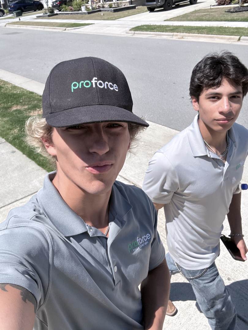 Two reps in ProForce polos out on a neighborhood route
